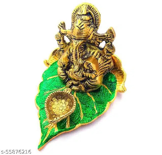 Elite Brass Metal Ganesh Ji Sitting on The Green Leave with Diya Deepak , Golden Decorative Showpiece - 9 cm  (Brass, Gold)